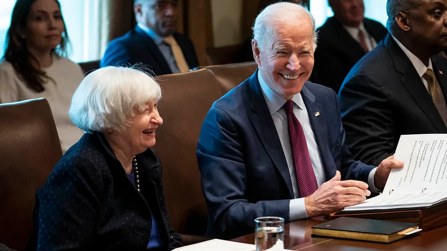 Janet Yellen and Joe Biden sitting at a table together