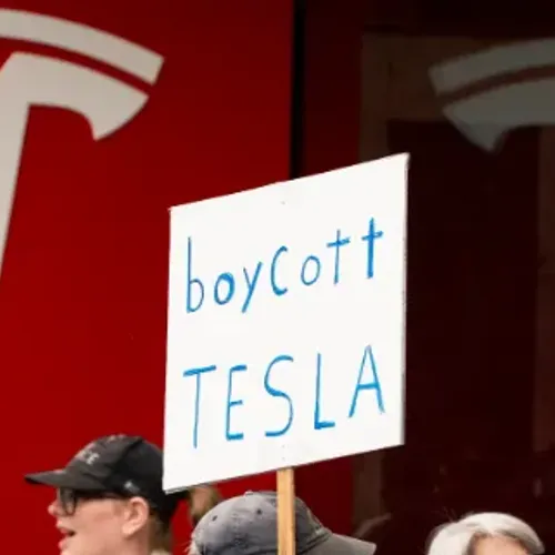Sign reading 'Boycott Tesla'