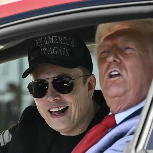 Musk and Trump inside of a red Tesla Model S