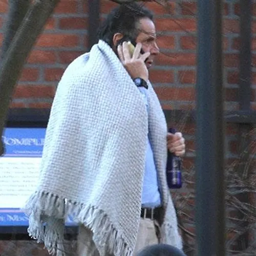 New York Governor Andrew Cuomo walks on the grounds of the Governor's Mansion