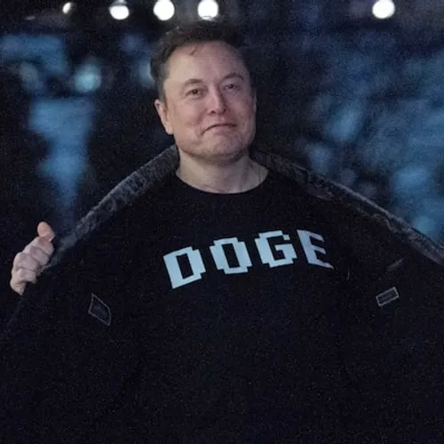 Elon wearing a DOGE t-shirt